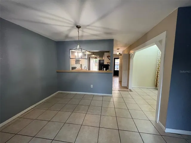 a view of a kitchen with a sink and cabinets