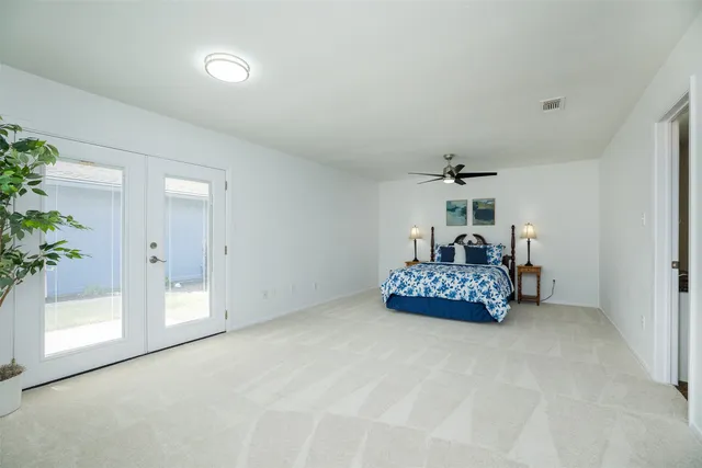 a bedroom with furniture and window
