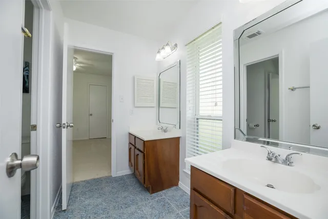a bathroom with a sink and mirror