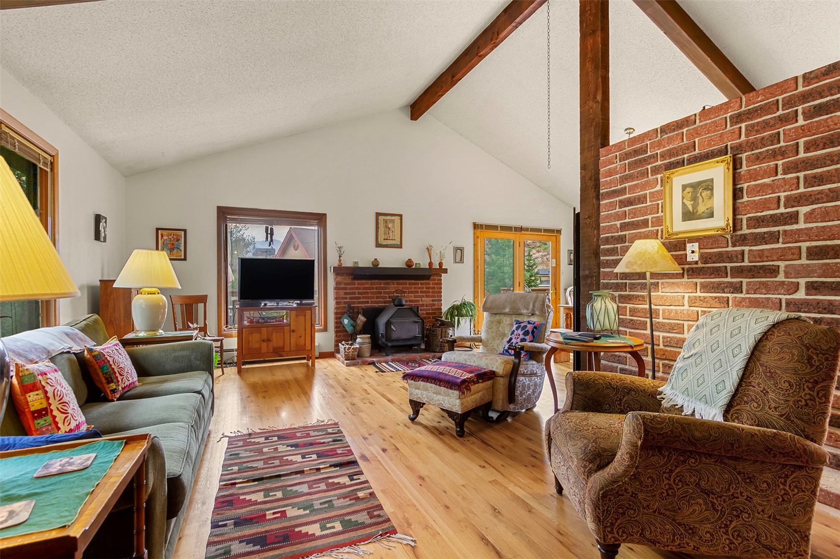 857 Deer Path Road Dillon, CO 80435 - Photo 4 of 29 a living room with furniture and a fireplace