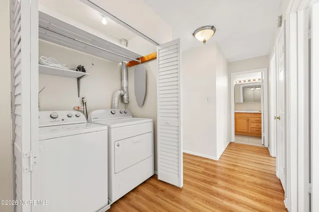 a bathroom with a sink mirror and vanity