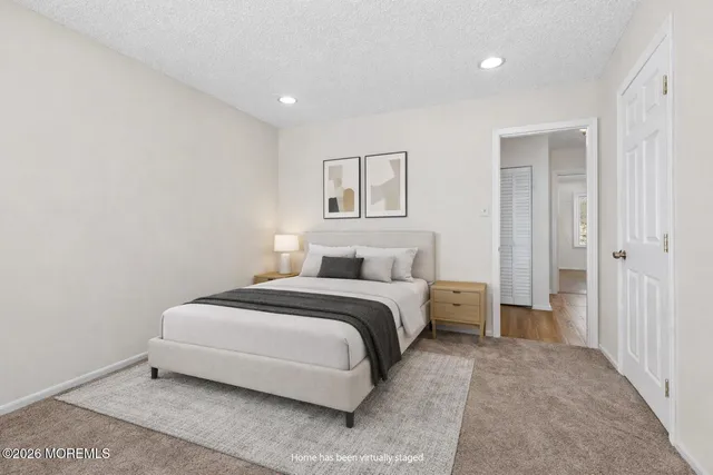 a bed room with a bed and a painting