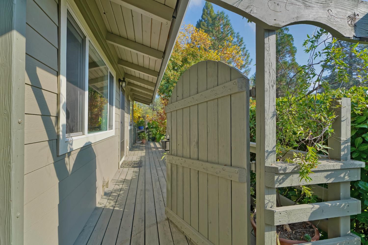 a view of balcony with wooden floor