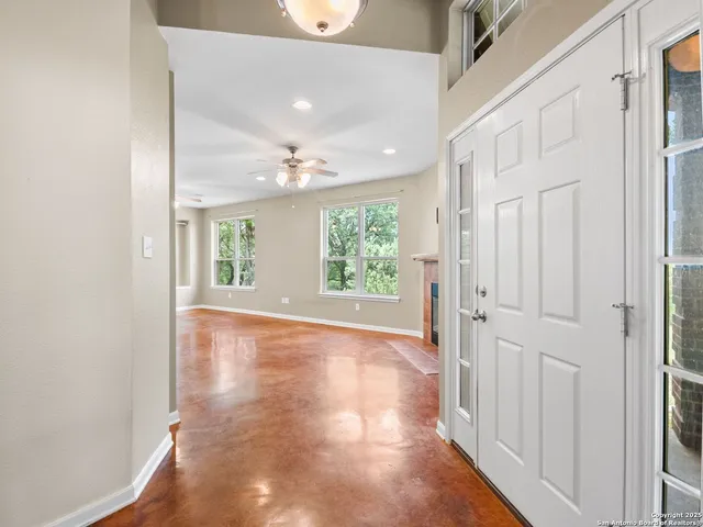 a kitchen with stainless steel appliances granite countertop a sink and a large window