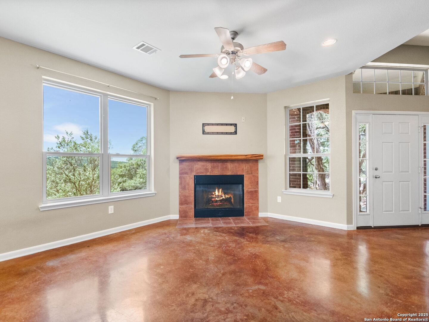 4366 Whartons Dock Road Bandera, TX 78003 - Photo 14 of 80 a view of an empty room with a window and fireplace