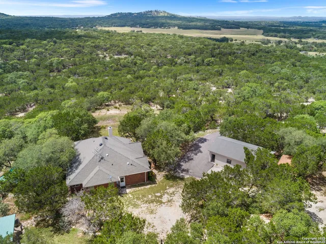 an aerial view of a house with a garden
