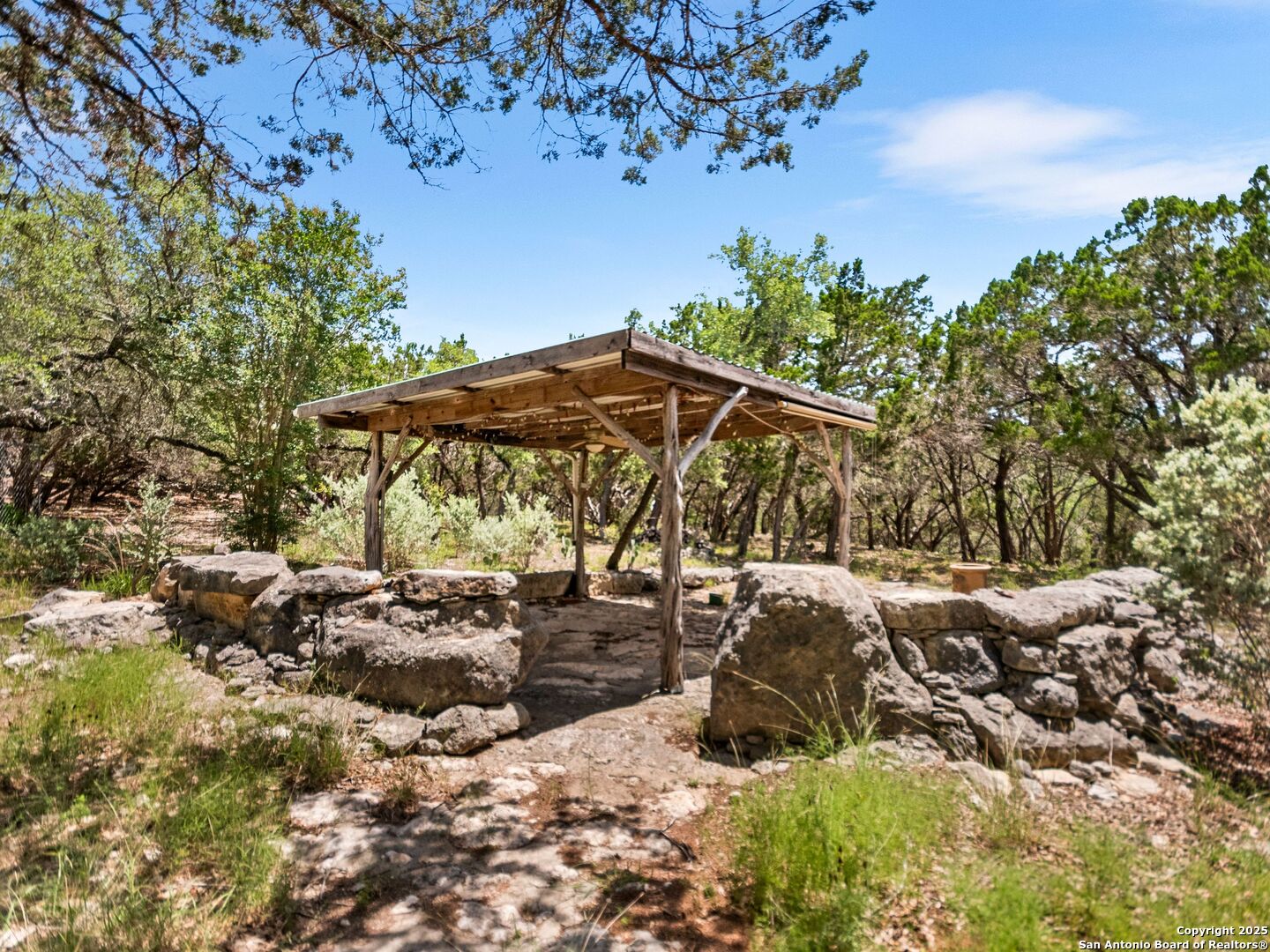 4366 Whartons Dock Road Bandera, TX 78003 - Photo 26 of 80 a view of backyard with outdoor seating