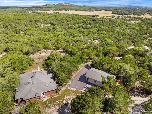 a view of a yard with an outdoor space