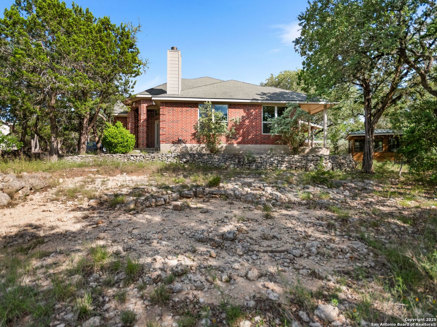 4366 Whartons Dock Road Bandera, TX 78003 - Photo 33 of 80 a view of a house with a yard