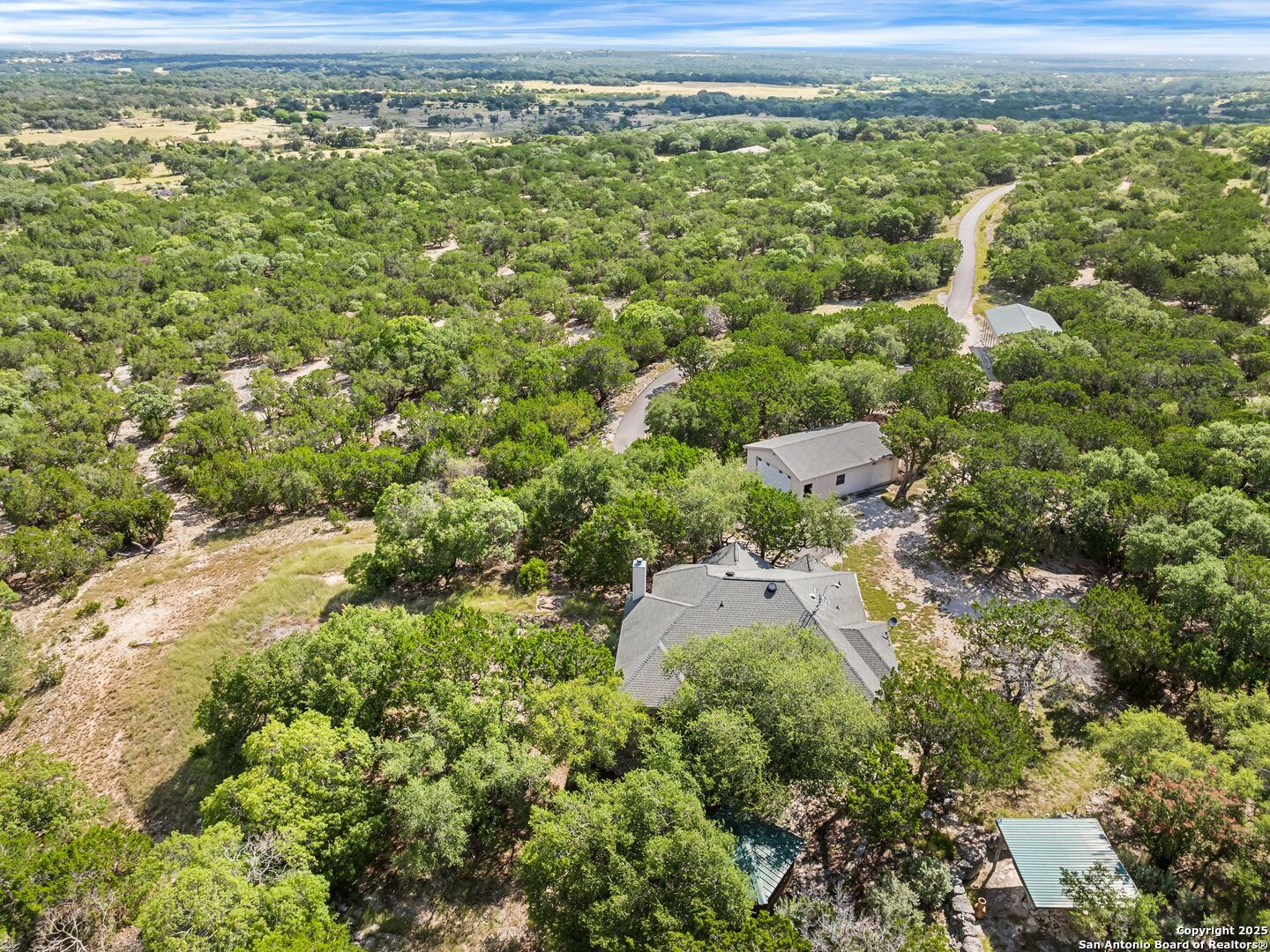 4366 Whartons Dock Road Bandera, TX 78003 - Photo 38 of 80 a view of a yard with an outdoor space