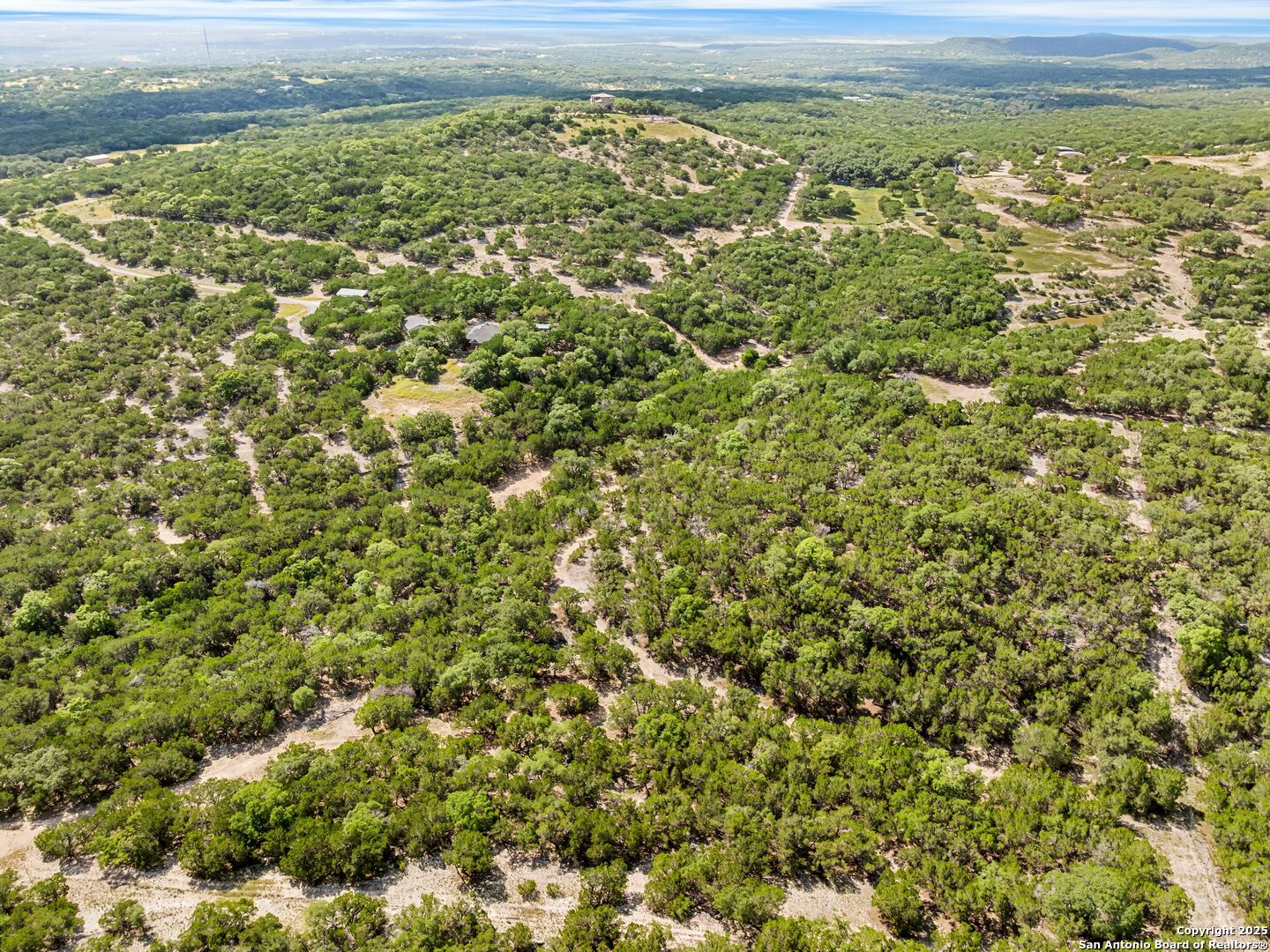 4366 Whartons Dock Road Bandera, TX 78003 - Photo 44 of 80 a view of a yard with an outdoor space