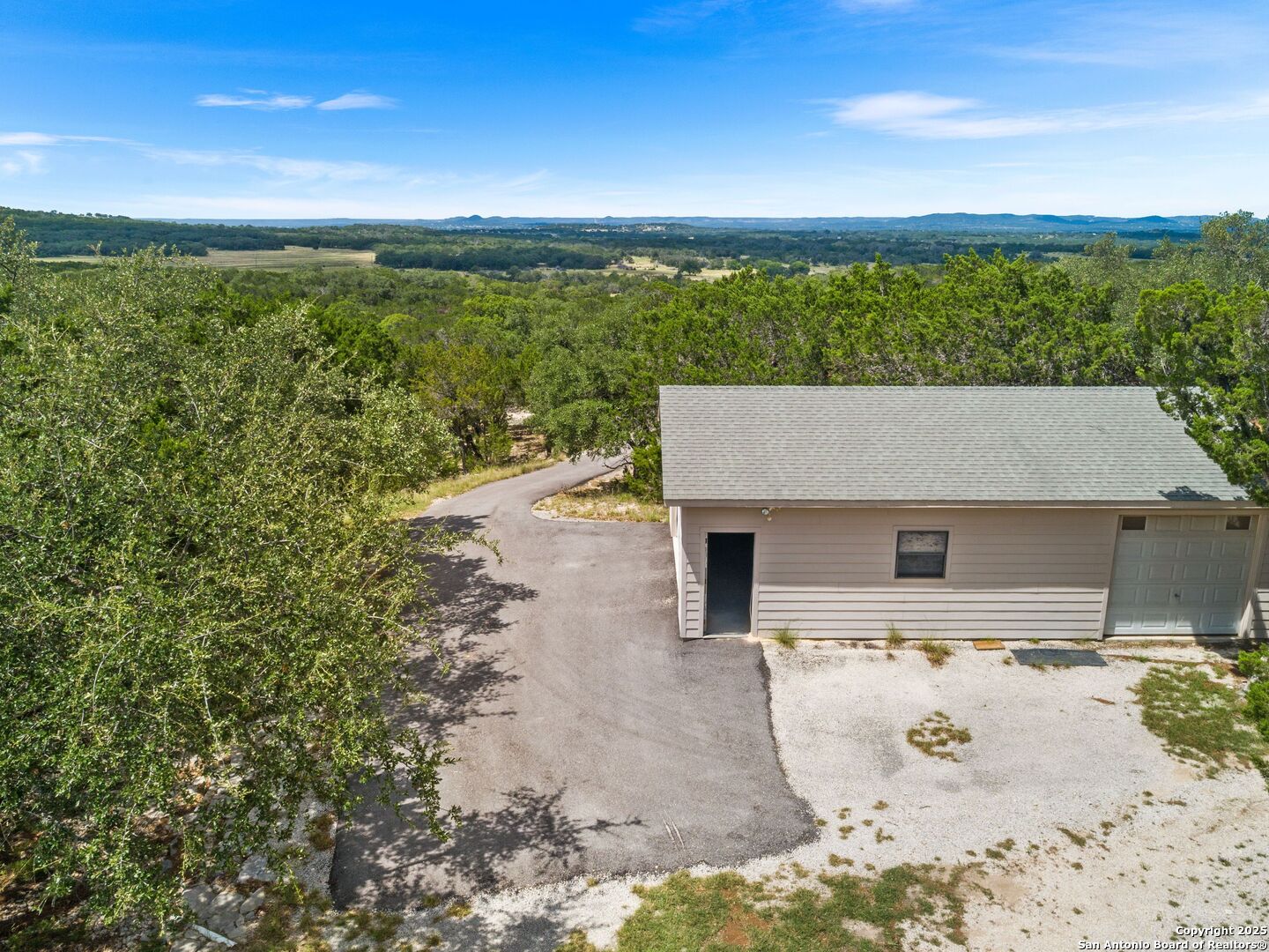 4366 Whartons Dock Road Bandera, TX 78003 - Photo 9 of 80 a view of a terrace with a garden