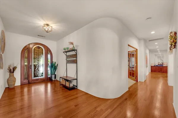 a kitchen with stainless steel appliances granite countertop a stove a sink dishwasher and a refrigerator