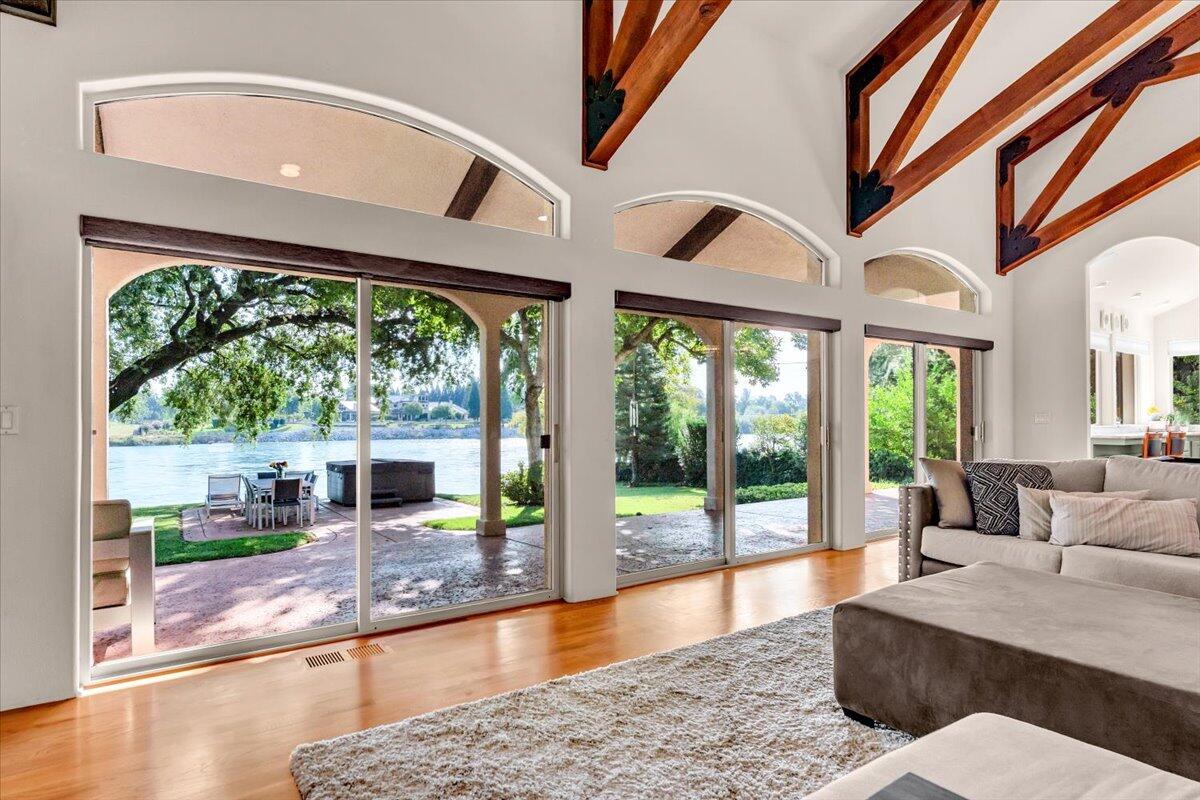 6681 Riverside Drive Redding, CA 96001 - Photo 22 of 124 a living room with large windows