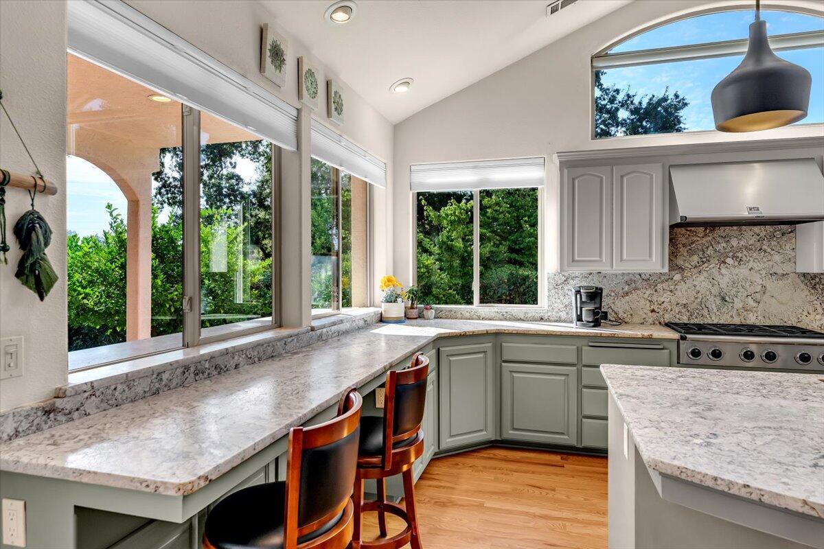 6681 Riverside Drive Redding, CA 96001 - Photo 29 of 124 a kitchen with a sink a window and cabinets