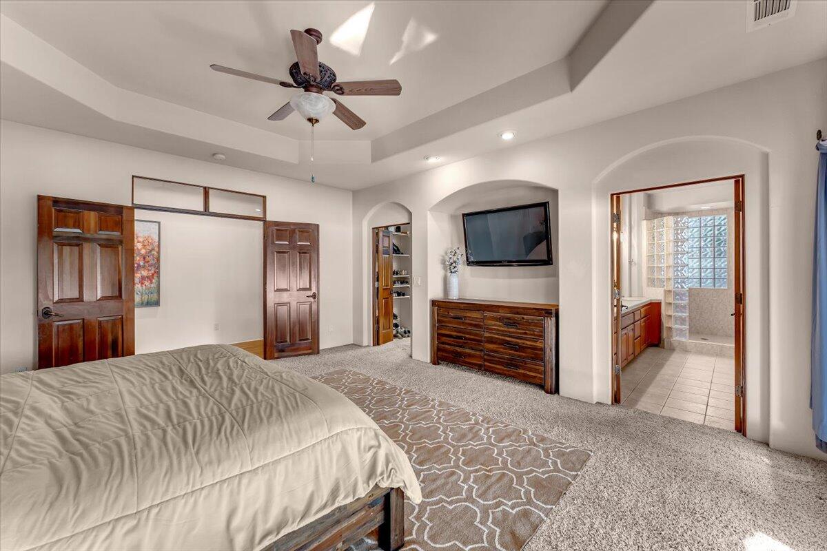 6681 Riverside Drive Redding, CA 96001 - Photo 47 of 124 a bedroom with a bed and a flat screen tv