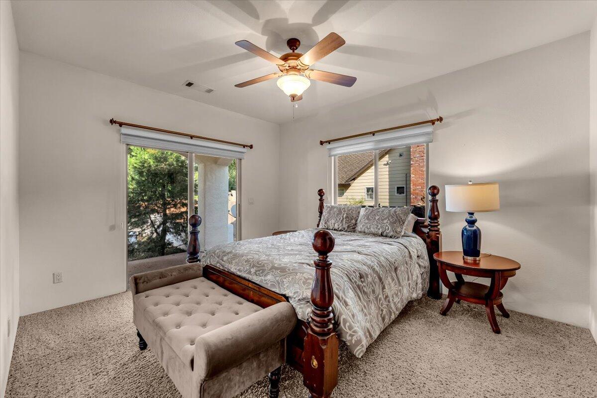6681 Riverside Drive Redding, CA 96001 - Photo 53 of 124 a bed room with a bed and a window