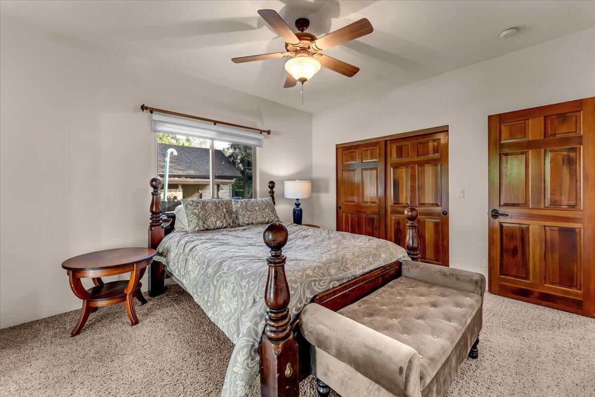 6681 Riverside Drive Redding, CA 96001 - Photo 55 of 124 a bed room with furniture and a window