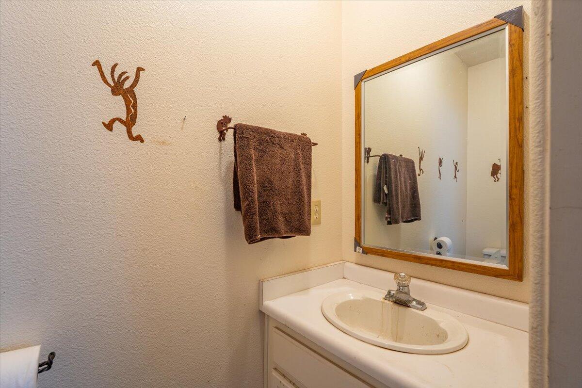6681 Riverside Drive Redding, CA 96001 - Photo 66 of 124 a bathroom with a sink and mirror