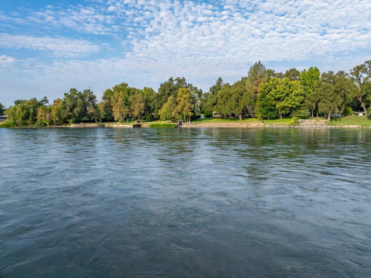 6681 Riverside Drive Redding, CA 96001 - Photo 70 of 124 a view of a lake with houses in the back