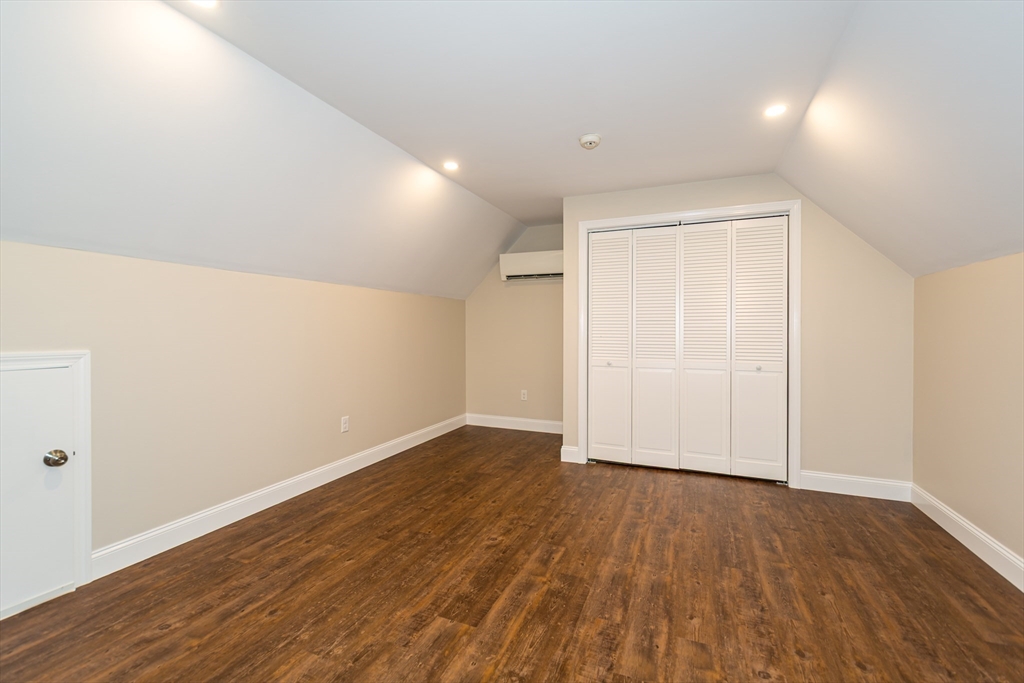 38 Westlake Road Natick, MA 01760 - Photo 29 of 36 a view of an empty room with wooden floor