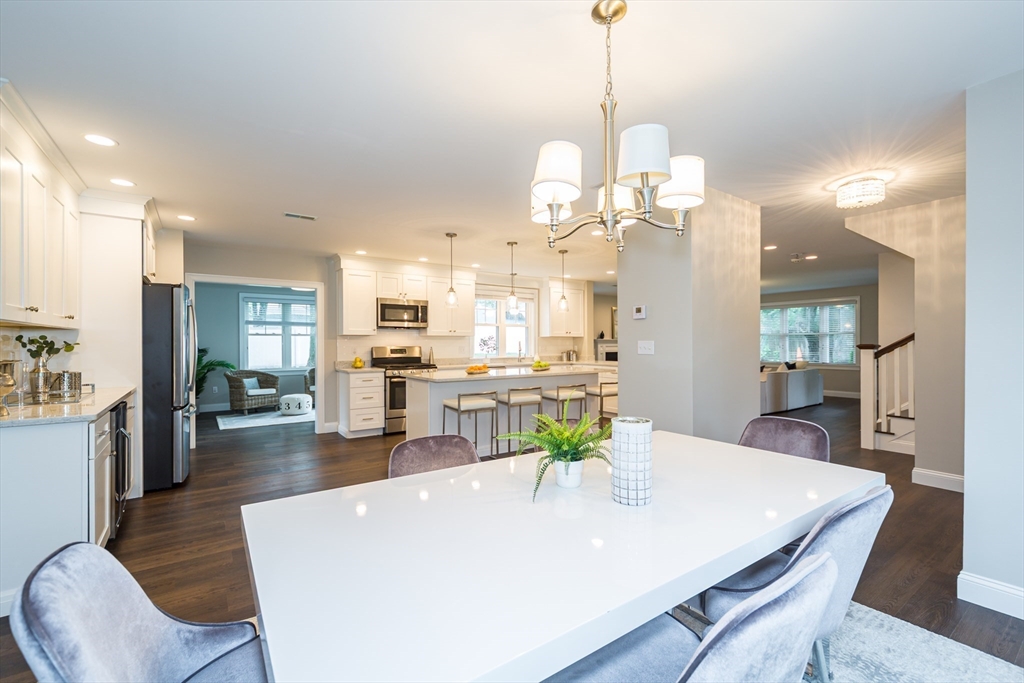 38 Westlake Road Natick, MA 01760 - Photo 10 of 36 a large kitchen with a table and chairs