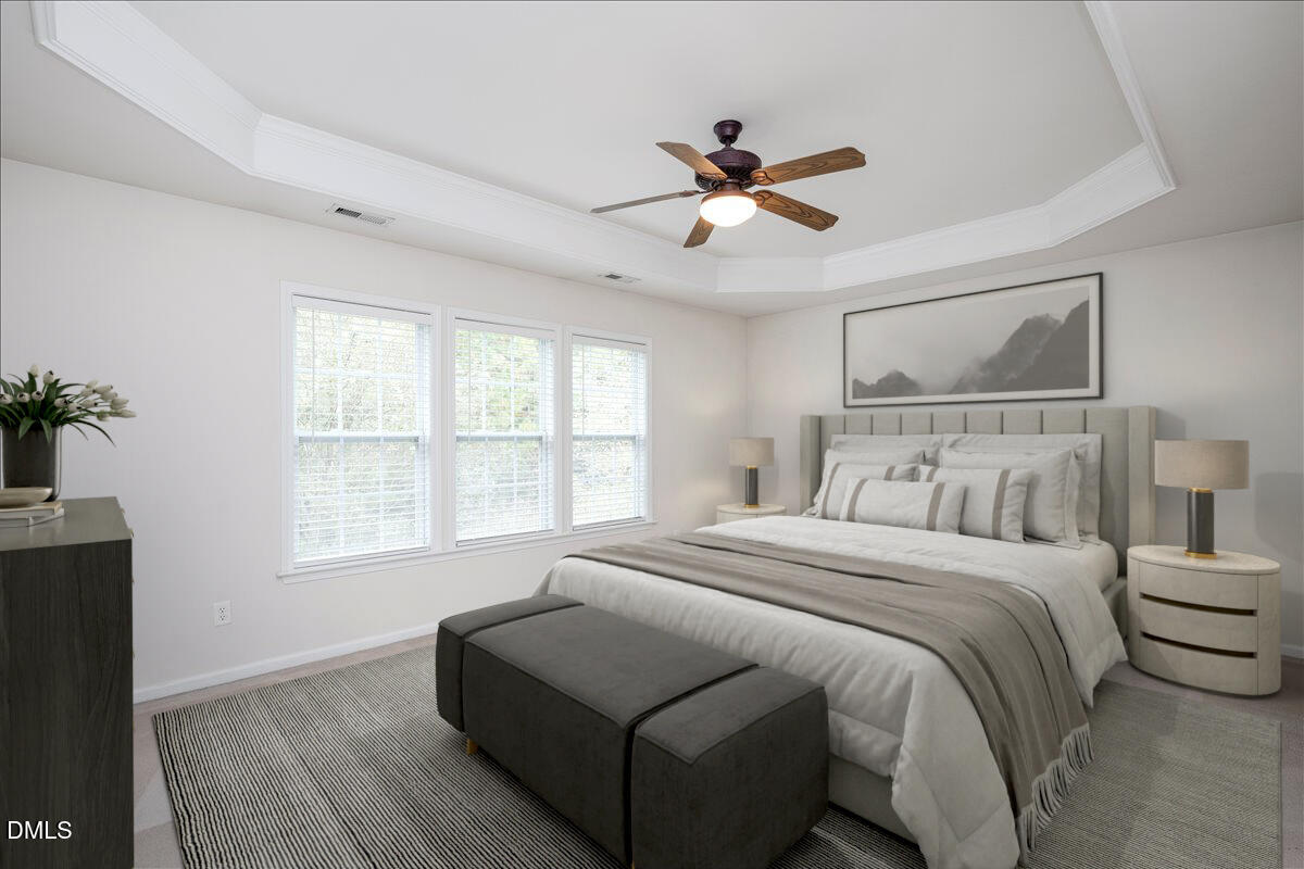 411 Amiable Loop Cary, NC 27519 - Photo 19 of 40 a bedroom with a large bed and a window