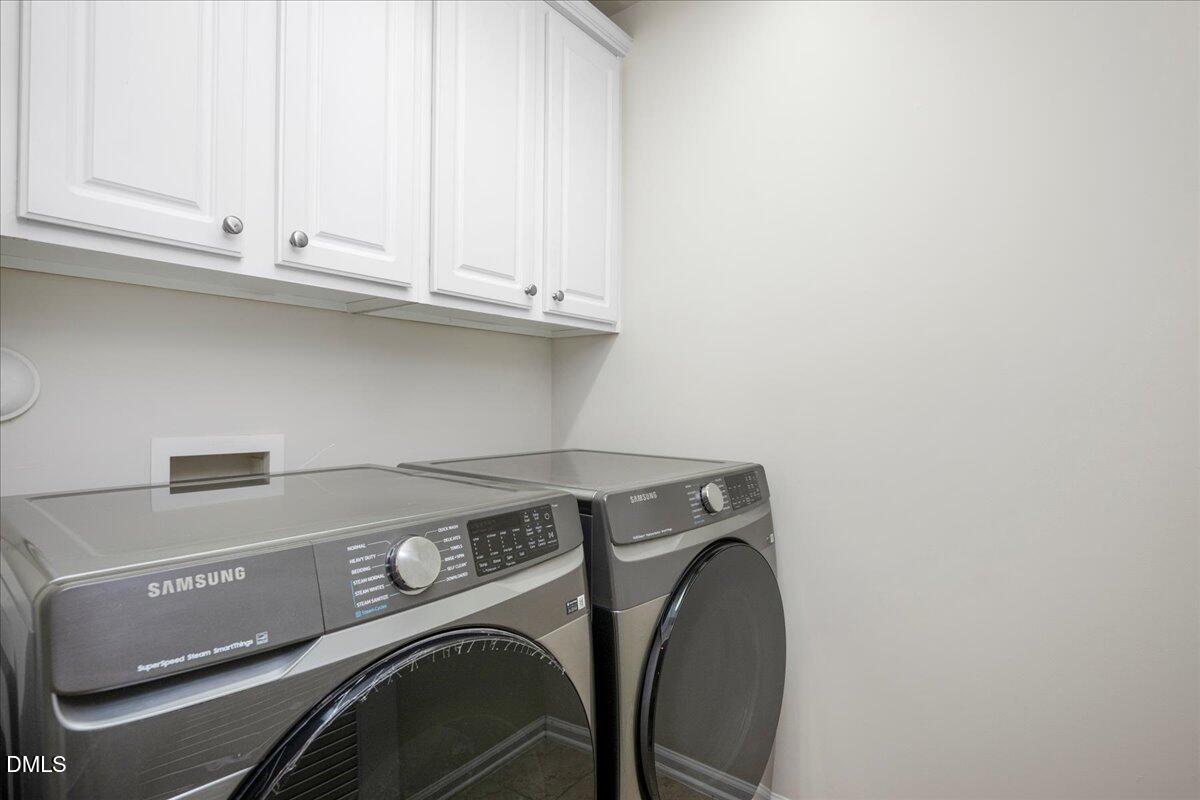 411 Amiable Loop Cary, NC 27519 - Photo 28 of 40 a utility room with dryer and washer