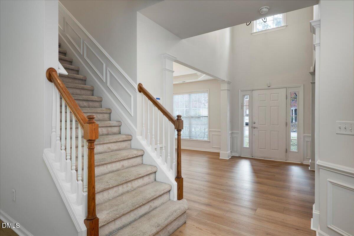 411 Amiable Loop Cary, NC 27519 - Photo 3 of 40 a view of an entryway with wooden floor