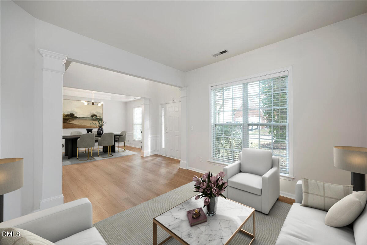 411 Amiable Loop Cary, NC 27519 - Photo 5 of 40 a living room with furniture and a large window