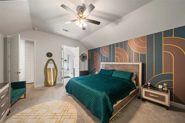 a bedroom with a bed next to a window and a chandelier