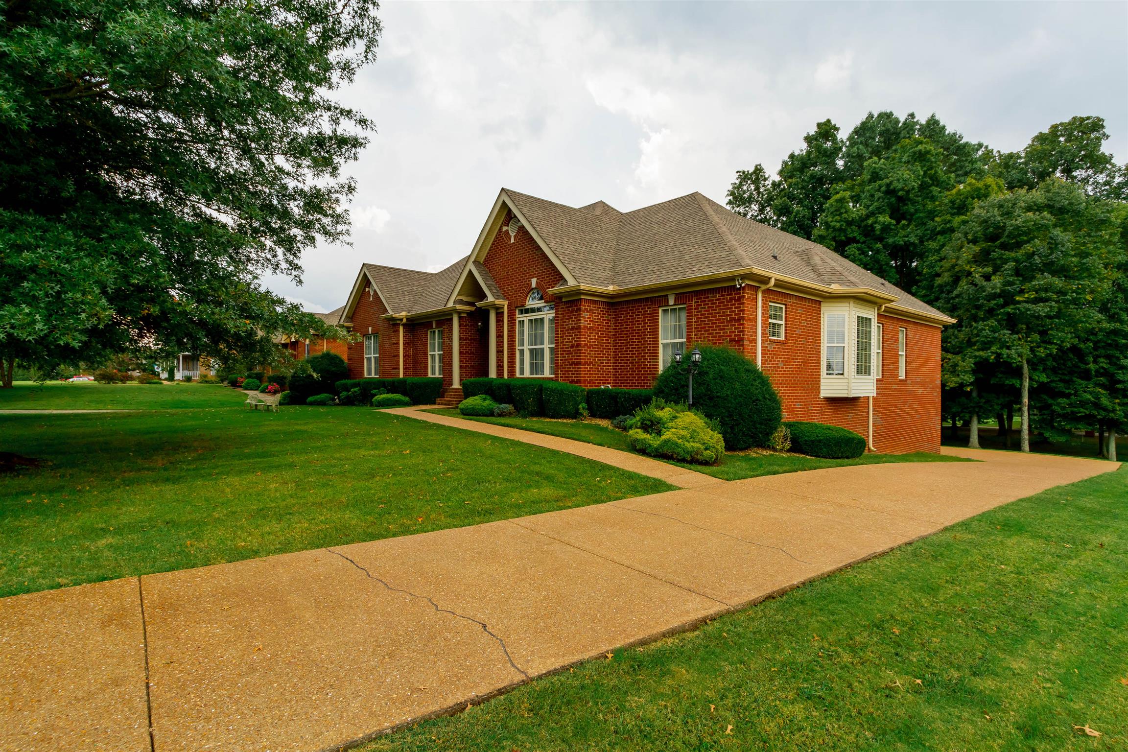 3611 Legacy Drive Springfield, TN 37172 - Photo 2 of 26 a front view of a house with a yard and garage