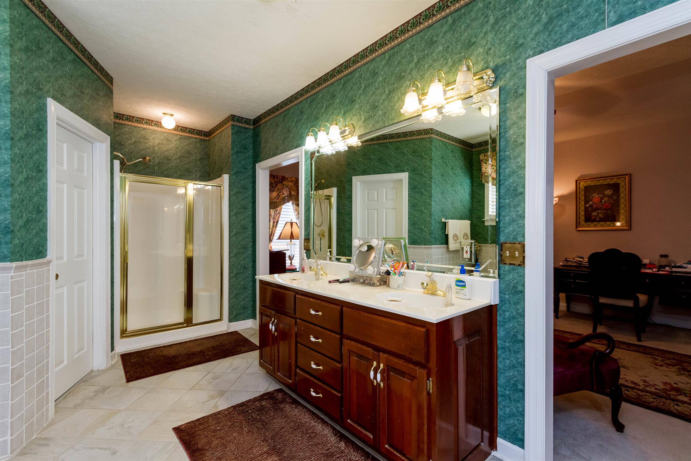 3611 Legacy Drive Springfield, TN 37172 - Photo 21 of 26 a bathroom with a sink vanity and a mirror