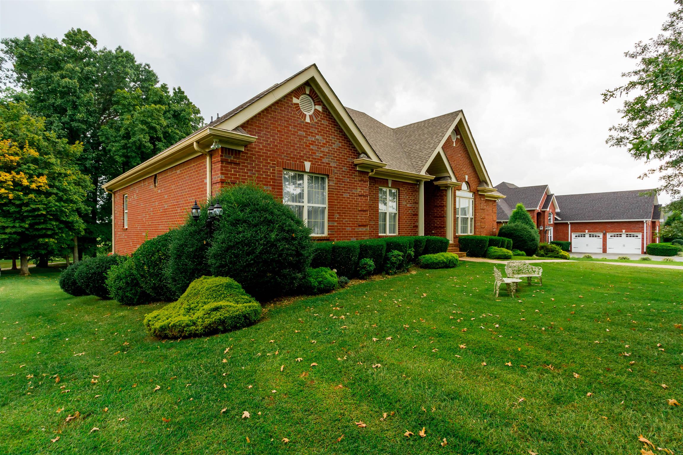 3611 Legacy Drive Springfield, TN 37172 - Photo 3 of 26 a front view of a house with a yard and green space
