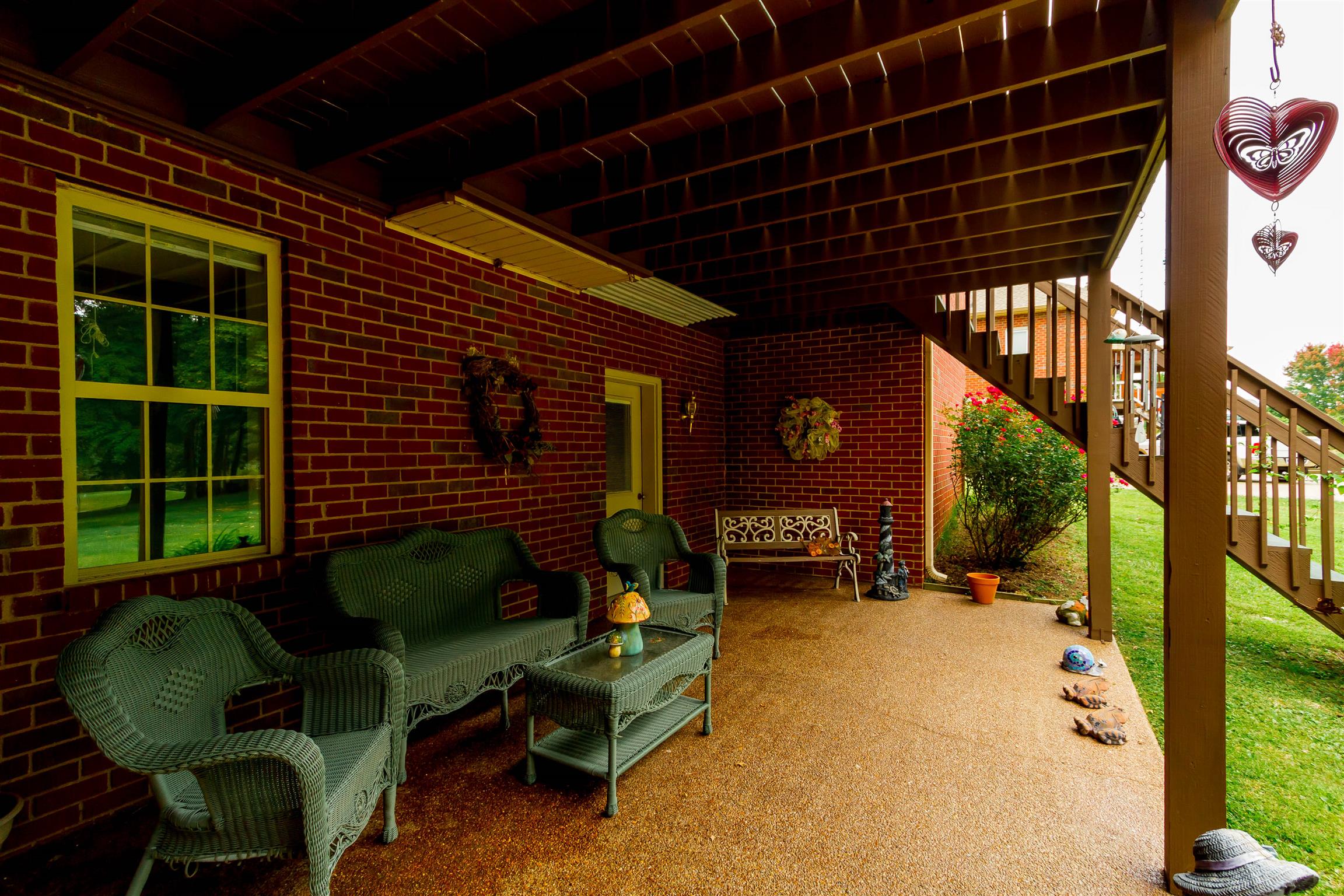 3611 Legacy Drive Springfield, TN 37172 - Photo 5 of 26 a view of a porch with chairs and a fire pit