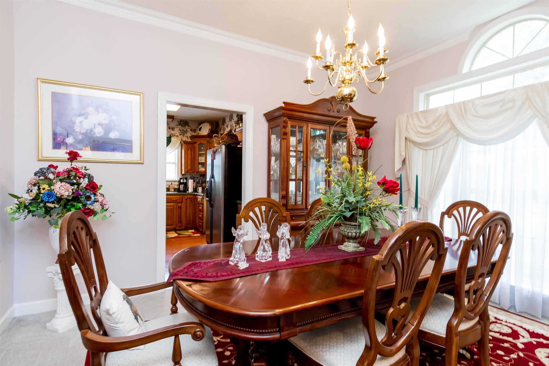 3611 Legacy Drive Springfield, TN 37172 - Photo 8 of 26 a dining room with furniture potted plants and wooden floor