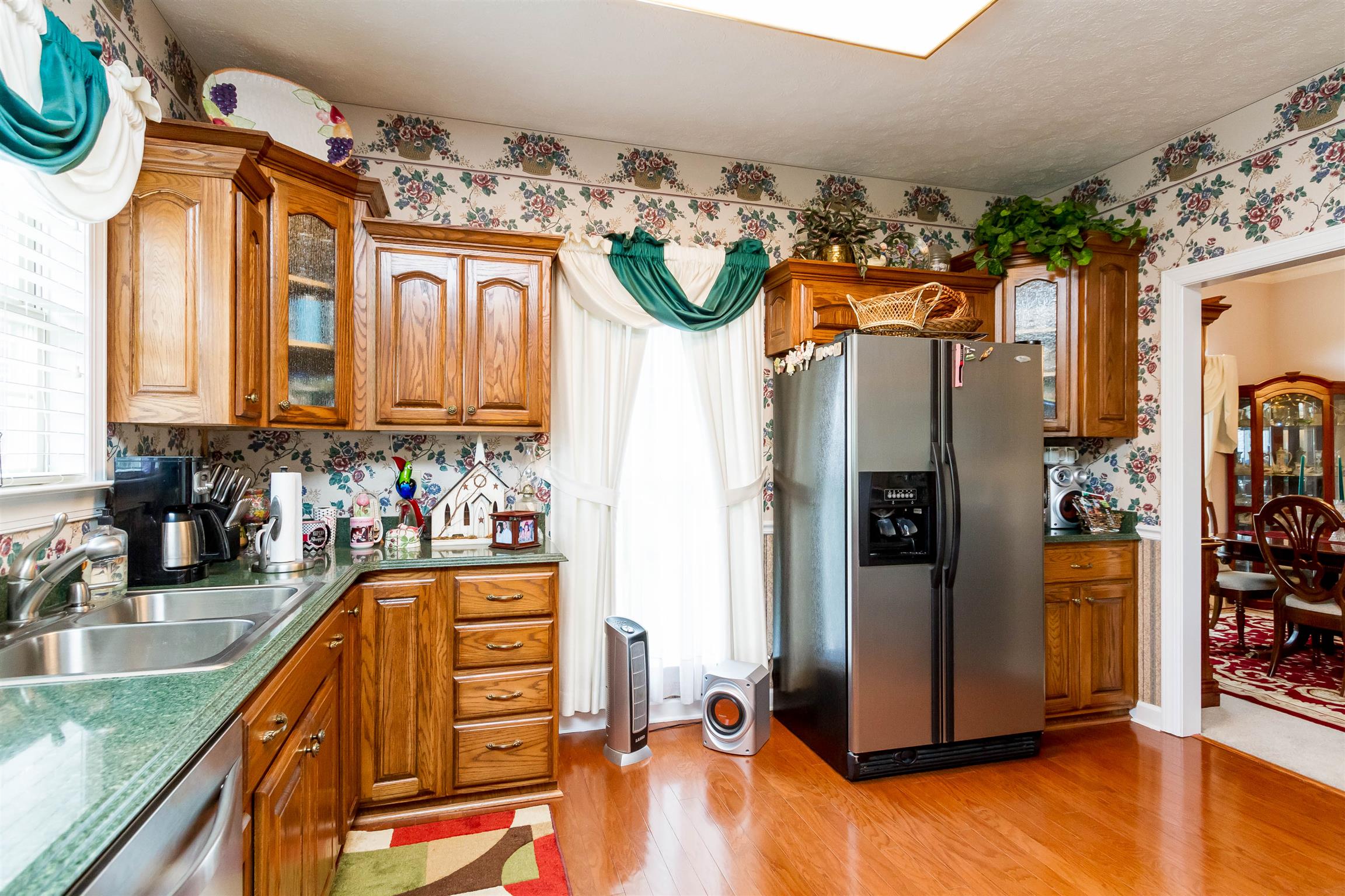 3611 Legacy Drive Springfield, TN 37172 - Photo 10 of 26 a kitchen with stainless steel appliances granite countertop a refrigerator and a stove top oven