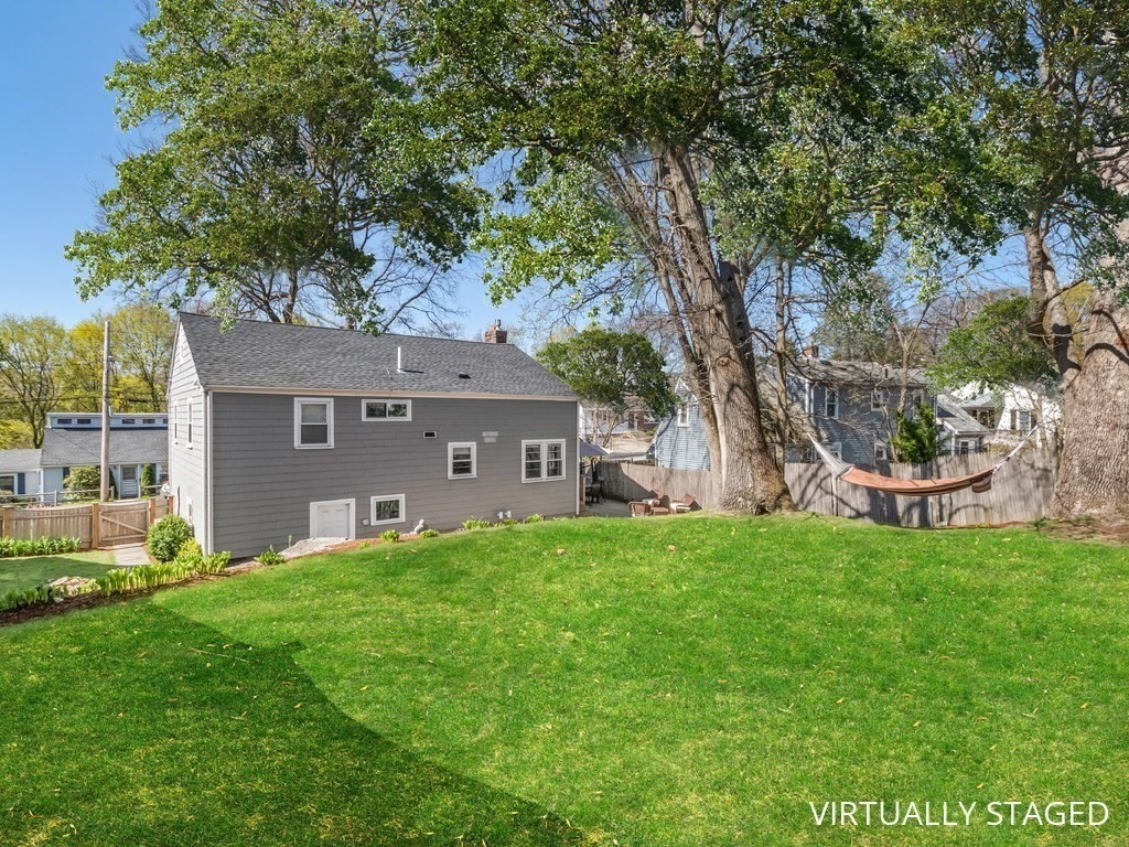 314 Florence Road Waltham, MA 02453 - Photo 3 of 40 a front view of house with yard and trees