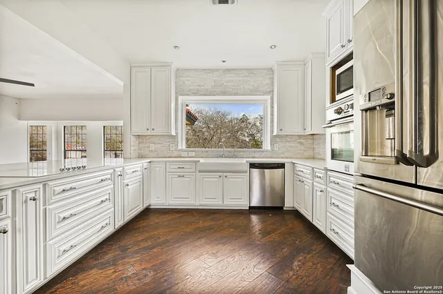 a view of a sink and mirror