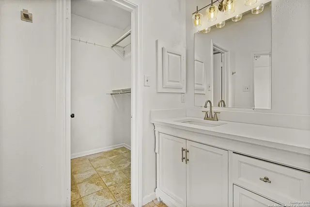 an empty room with a ceiling fan