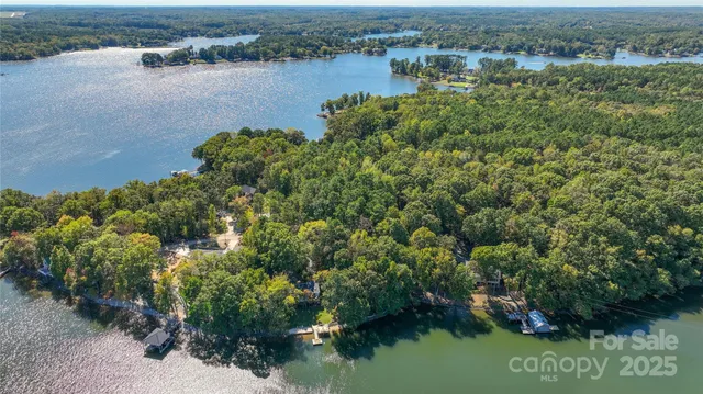 an aerial view of a house with a lake view