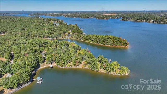 a backyard of a house with lots of green space and a building