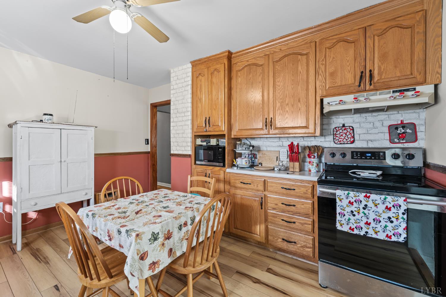 3169 Centerville Road Bedford, VA 24523 - Photo 11 of 25 a kitchen with stainless steel appliances granite countertop a stove a sink dishwasher and cabinets with wooden floor