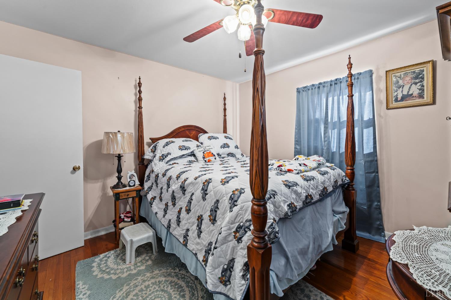 3169 Centerville Road Bedford, VA 24523 - Photo 16 of 25 a bedroom with a bed and a chandelier