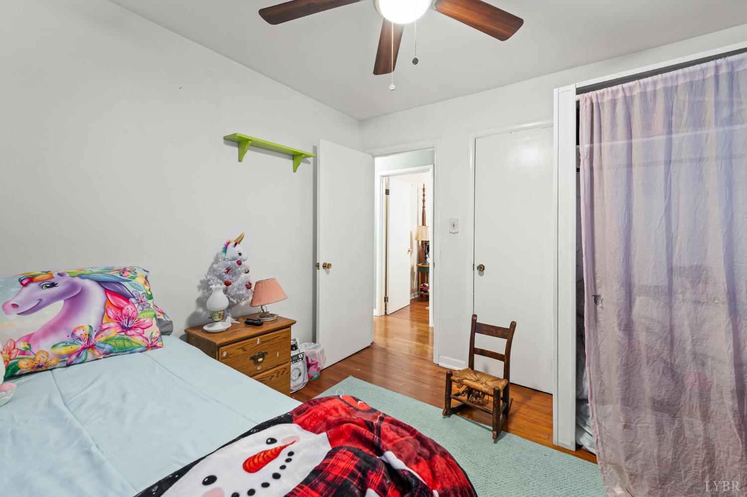 3169 Centerville Road Bedford, VA 24523 - Photo 18 of 25 a bedroom with a bed and a wooden floor
