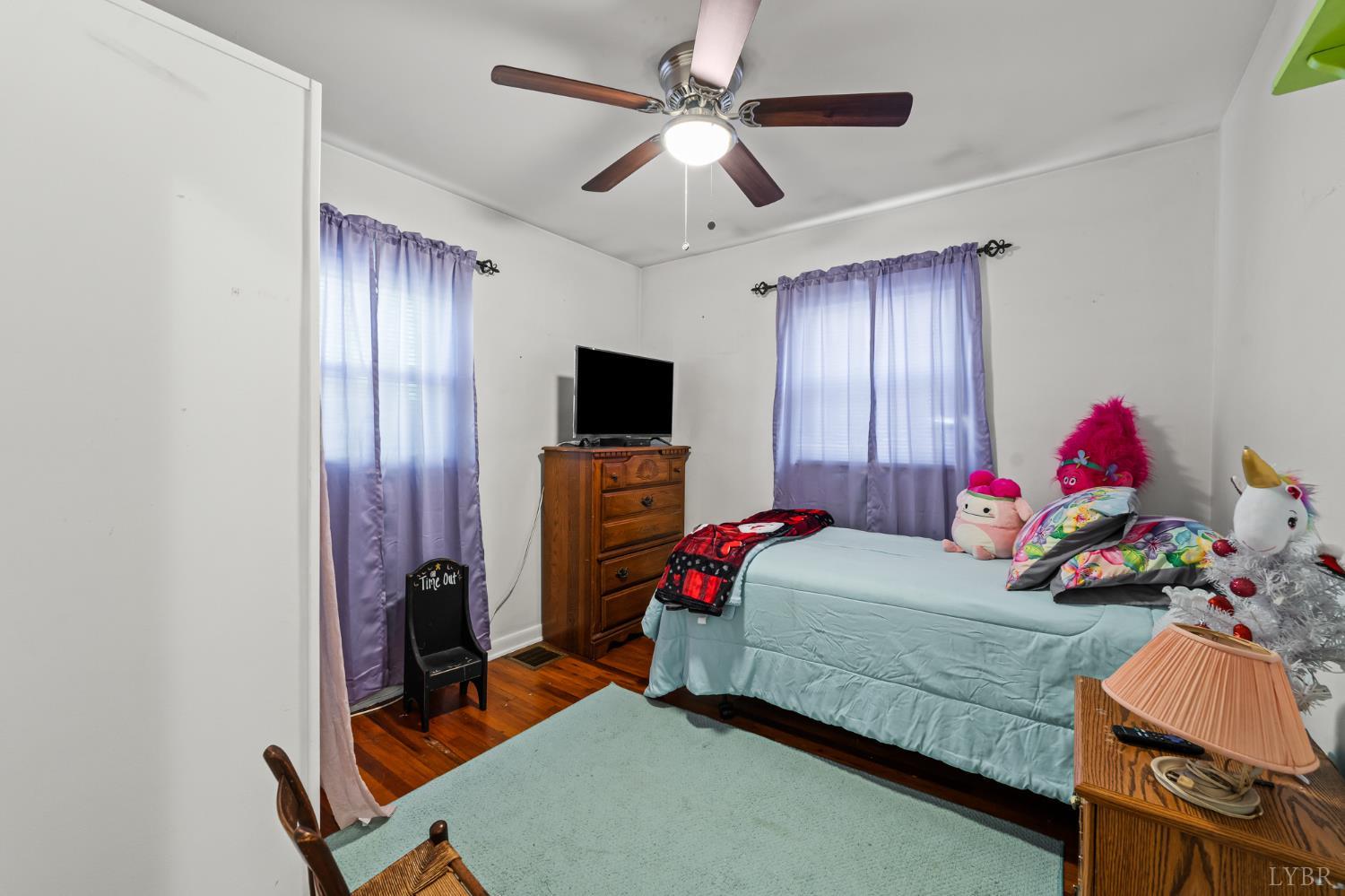 3169 Centerville Road Bedford, VA 24523 - Photo 19 of 25 a bedroom with a bed and a flat screen tv
