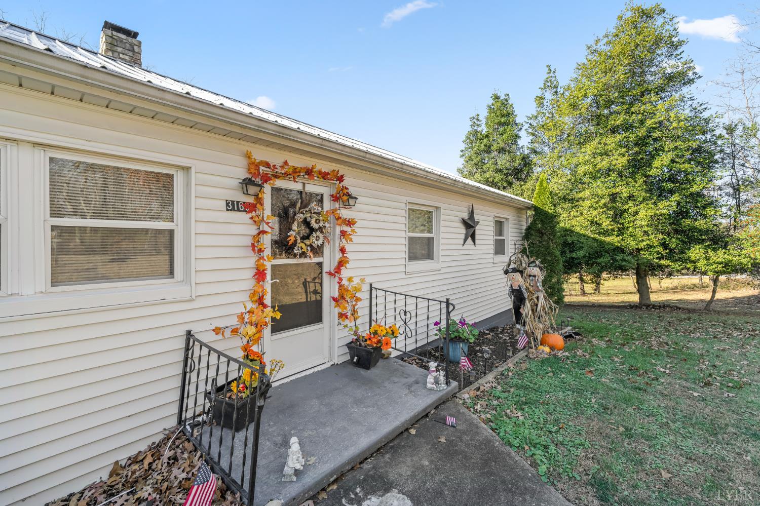 3169 Centerville Road Bedford, VA 24523 - Photo 25 of 25 a view of a house with backyard and a tree