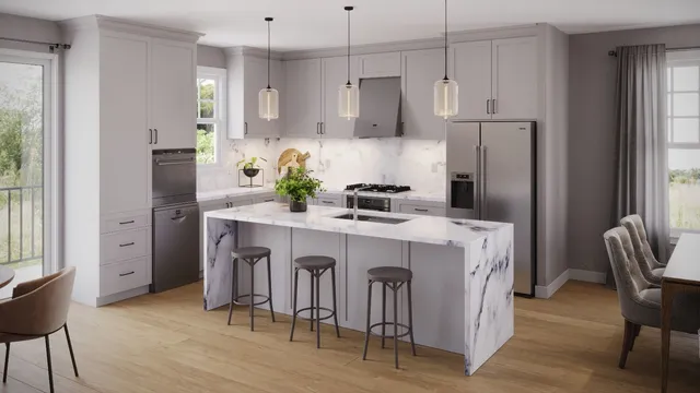 a kitchen with kitchen island white cabinets and stainless steel appliances