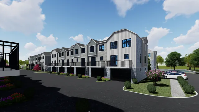 a view of multiple houses with a street