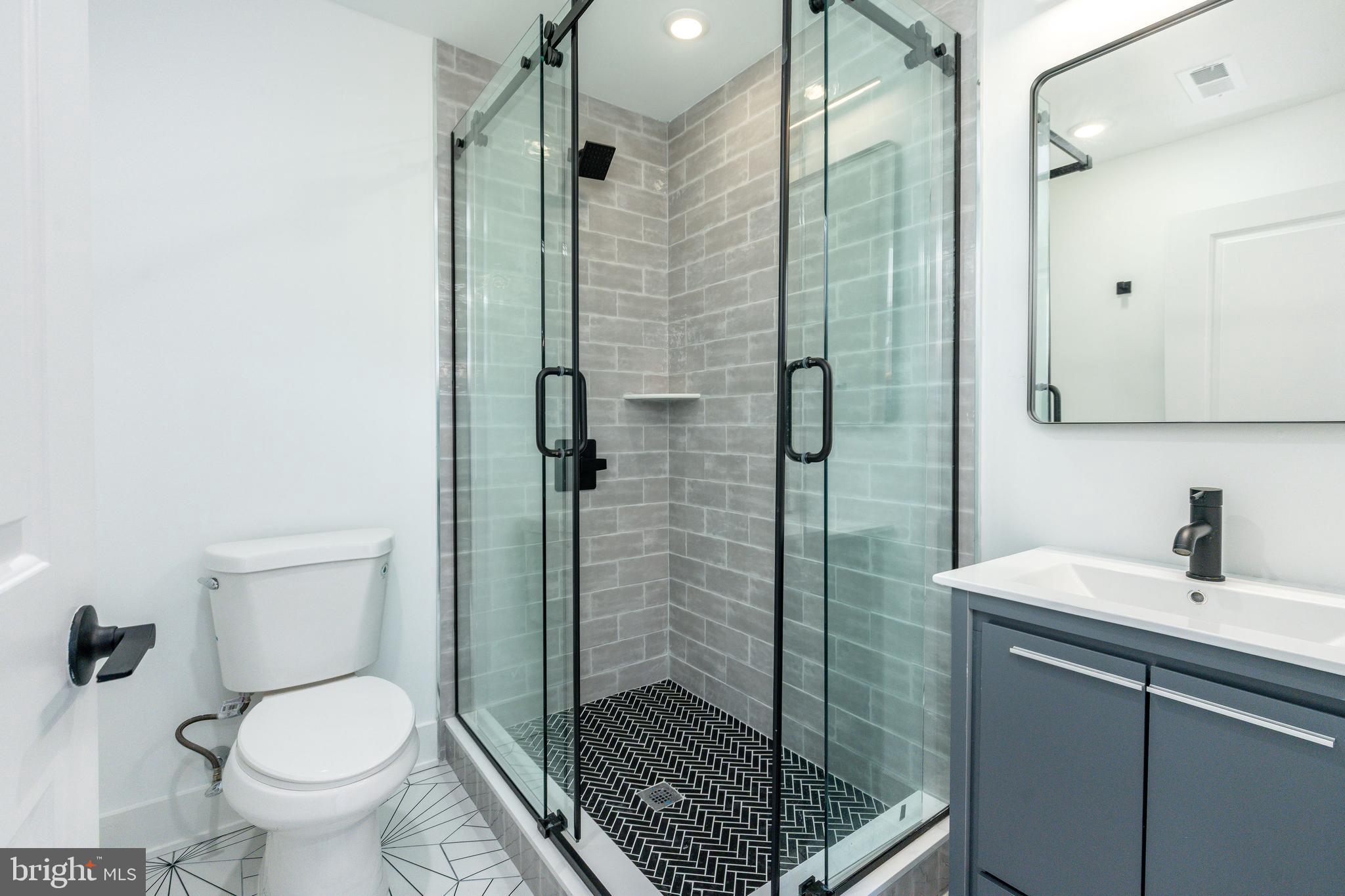 2252 North Front Street, Unit 2 Philadelphia, PA 19133 - Photo 8 of 15 a bathroom with a shower toilet and sink